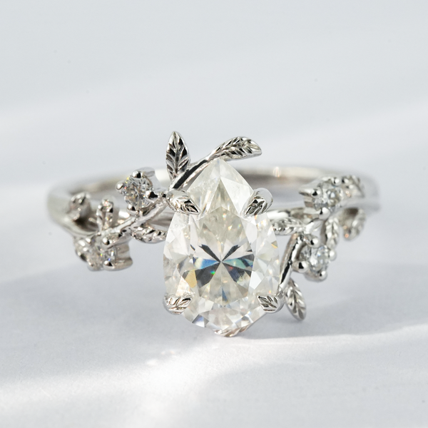 “Apex Aurora”-White Gold Pear Shaped Moissanite Leaf Shaped Ring